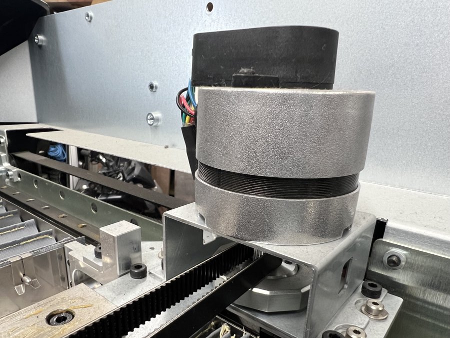 An axis motor and its belt drive.