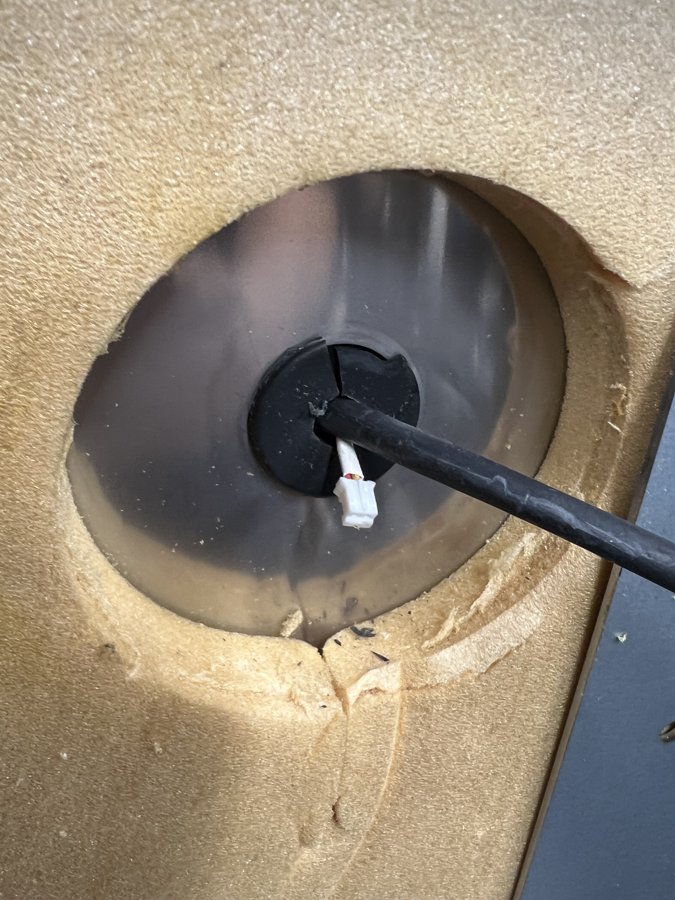 The blower shaft passing through the chamber insulation.