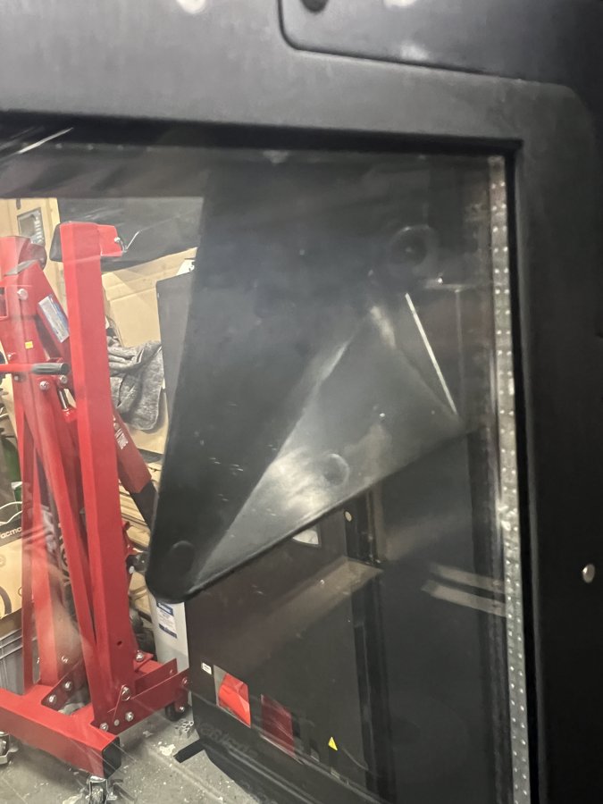 The camera tucked inside the door structure, behind the glazing.