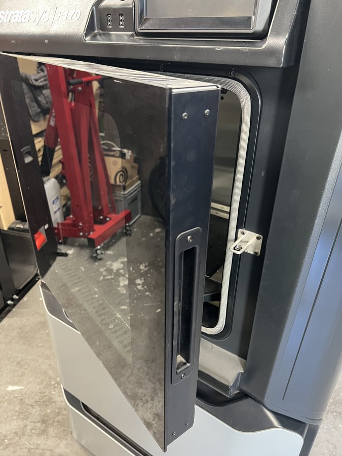 The open oven door, showing its depth and vented edge.